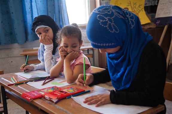 [Summer art class in an UNRWA school. Image by Kristian Buus.] 