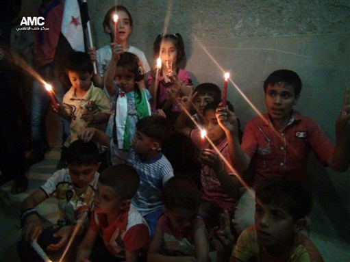 [Children from Aleppo remember those killed in Banyas this past week. 6 May 2013. From Aleppo Media Center.]