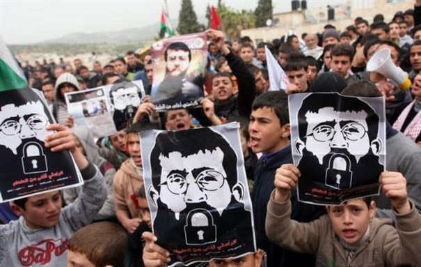 [Image of protest for Khader Adnan. Image from enduringamerica.com] 