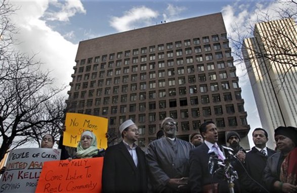 [Omar Mohammedi, fourth from right, New York City Human Rights Commissioner, joins a press conference with Muslim leaders excluded from a meeting with New York City Police Commissioner Raymond Kelly on 9 March 2012 at police headquarters in New York. Mohammedi was among a few select leaders who met with Kelly over the police department`s spy program in Muslim communities across the Northeast. Photo by Bebeto Matthews/AP Photo]