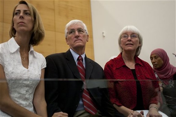 Cindy, right, and Craig Corrie, center, sit together with their daughter Sarah in the court room just before the district court`s ruling in Haifa, Israel, Aug. 28, 2012. Image by Ariel Schalit/AP Photo.]