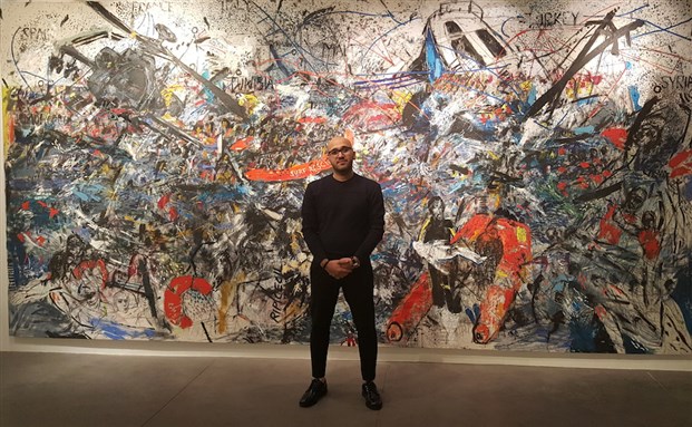 [Artist Abed Al Kadiri in front of his monumental work `At Sea` (2016).]