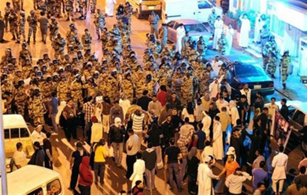[Anti-riot police standoff with protesters. Image from Rasid.com]
