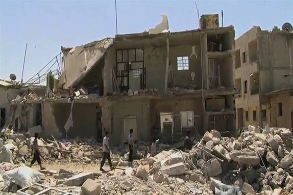 [After aerial bombardment by the Syrian government of rebel-held areas of Azaz in Aleppo governorate, Photo from Wikipedia]