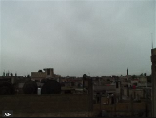 [The Bab al-Amr neighborhood in Homs. Image from video below.]