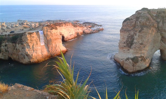 [Banner facing the Raoucheh Rock: \"Dalieh Belongs to Us\"]