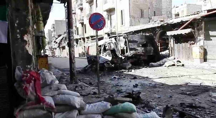 [Bombed out vehicles in Aleppo. Image from Wikimedia Commons]