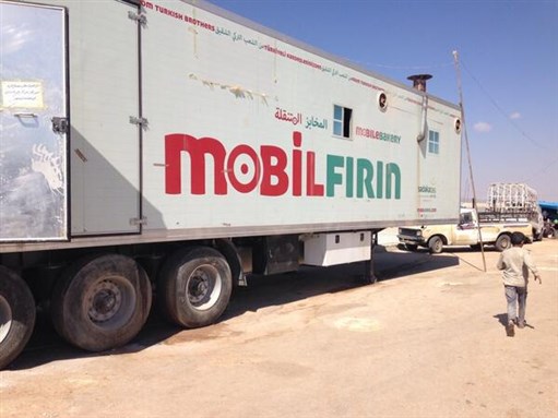 [Mobile bakery for the Syria refugee camps in Turkey. 21 June 2014. Photo by Lina Sergie Attar (@AmalHanano)]. 