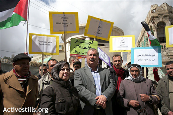 [MK Mohammed Barakeh at a demonstration against settlements in Hebron. Image from ActiveStills.]