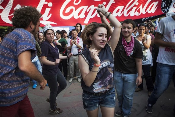 [People dance in Gezi Park on the eleventh day of the resistance there, 7 June 2013. Photo by Tolga Sezgin/Nar Photos.]