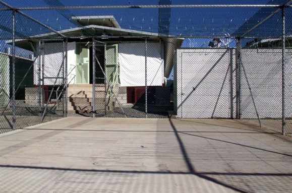 [Camp Delta at Guantanamo Bay, current location of detainee Omar Khadr and other designated `enemy combatants`. Image from Wikimedia Commons.]