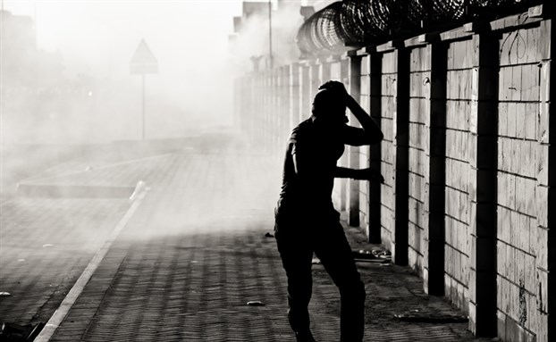 [Clashes between protestors and riot police after a funeral in Sitra. 1 January 2012. Image from Saeed Saif.]
