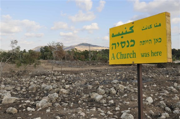 [Image from ruins of the Palestinian village of Damoun, featuring a plaque by the Zochrot Truth Comission. Image by the author.]