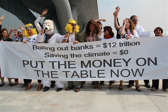 [Protestors at the Doha Climate Change Summit. 5 December 2012. Photo by ideasforacoolerworld]