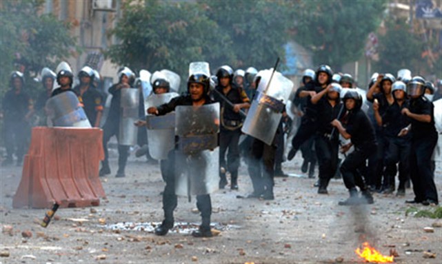 [Egyptian riot police crackdown on protesters 29 June 2011. Image from unknown archive.]