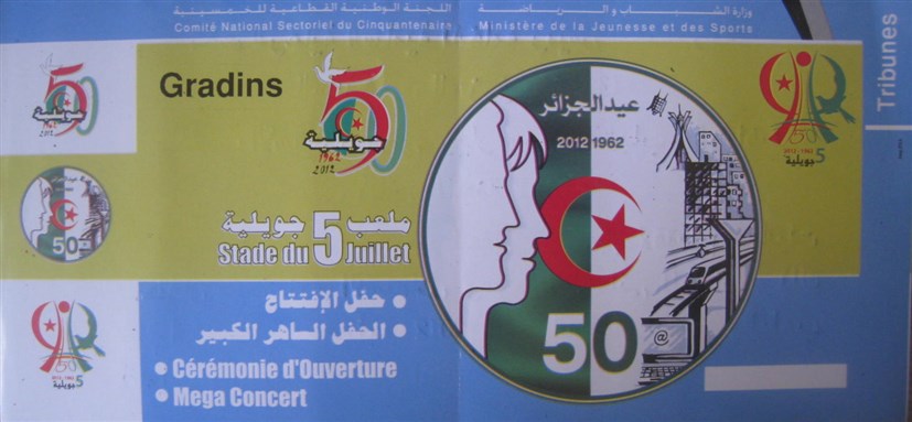 [The ticket for the celebrations at the 5th July Stadium which bears the official logo for the 50th anniversary seen all around Algiers. Image by author.]