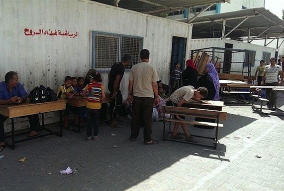 [ \"Images from at the elementary school in Gaza’s Rimal neighborhood, where UNRWA is housing refugees who left their homes on orders from the Israeli military on the night between 12 and 13 July, 2014. Image by Muhammad Sabah.]