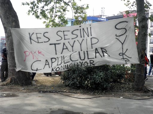 [Banner reading: “Shut your mouth, Tayyip, the bums [çapulcular] are talking,” Gezi Park, 5 June. Photo by Christiane Gruber.]