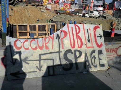 [Makeshift sign reading “Occupy Public Space,” Taksim Square, 10 June 2013. Photo by Christiane Gruber.]