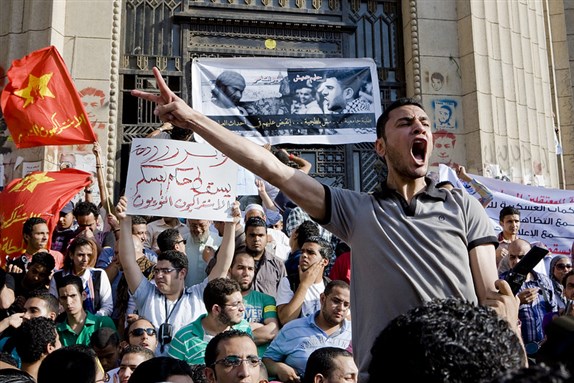 [Protesters marching on the Egyptian Parliament to protest the Abbassiya crackdown. Image by Hossam el-Hamalawy.]
