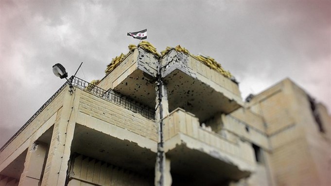 [A building in Qusair, Homs. Photographed by revolutionary artist and martyr, Ashraf Al-Ahmad. Image courtesy of SNN.]