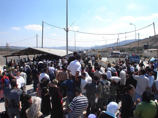 [View from Nablus side of Howwarah checkpoint people waiting to travel south. Image by Harry Pockets.]