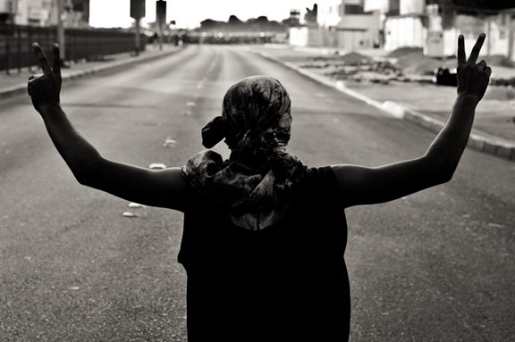 [Clashes between protestors and riot police after a funeral in Sitra, Bahrain, in April 2012. Image by Saeed Saif.]