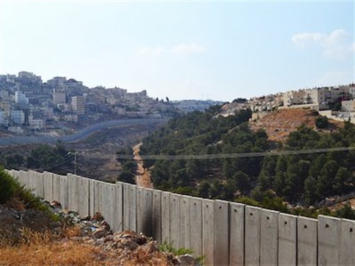 [Separation barrier in Jerusalem. Image by Trocaire via Flickr]