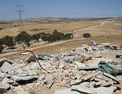 [Demolished Bedouin structure in the Naqab (Negev). Image by Josh Hough.]