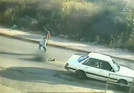 [Security camera capture Abu Saleh attacking his cousin to death. A frame from the Israeli Channel 2 News.]