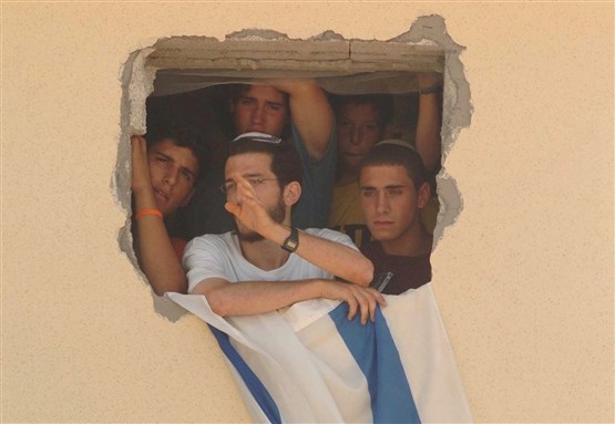 [Crop of image of settlers from the Gaza settlement of Bedolach during evacuation. Image from Wikimedia Commons.]