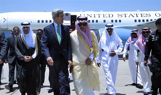 [US Secretary of State John Kerry is met by Saudi Foreign Minister Saud Al-Faisal on a recent visit to the kingdom. Relations between the two governments have soured over US policy in Syria and Iran. 25 June 2013. USDOS/flickr/Public Domain]
