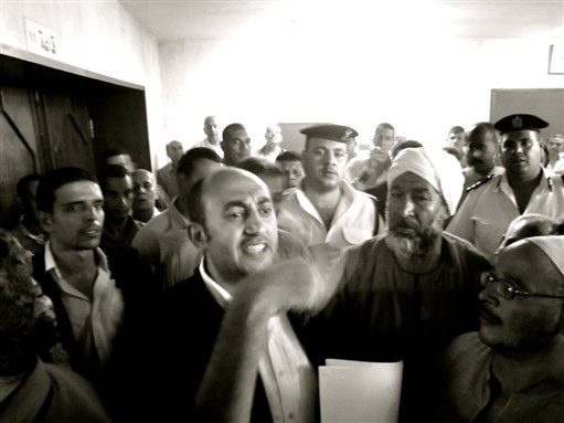 [Rights lawyer Khaled Ali protesting privatization with Egyptian workers in July 2011. Photo from Wikimedia Commons.]