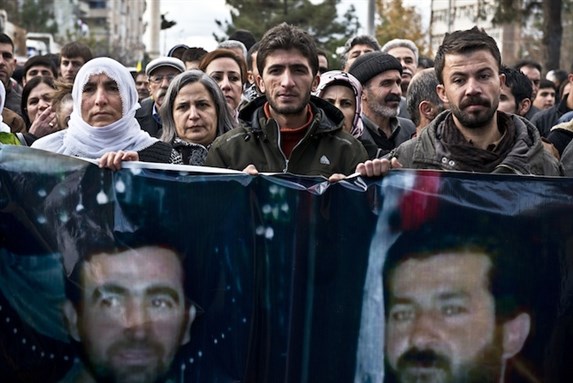 [March in Diyarbakir for Mehmet Resit Isbilir and Veysel Isbilir, who were shot and killed by police in Yuksekova Hakkari. Police attacked the march with gas bombs and pressurized water. Photo by Lezgin Kani / Nar Photos.]