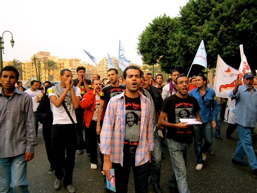 [28 October 2011, protesters march to Maspero demanding justice for those who were killed on 9 October 2011 by the security forces. Protesters wearing shirts in Arabic that read: \"We are all Mina Daniel\" Photo by Gigi Ibrahim via Flickr.] 