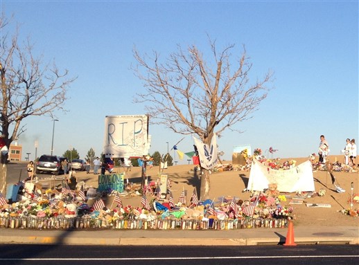 [The memorial outside the Aurora Century Theater, where the shooting occurred. Image from Wikimedia Commons.]