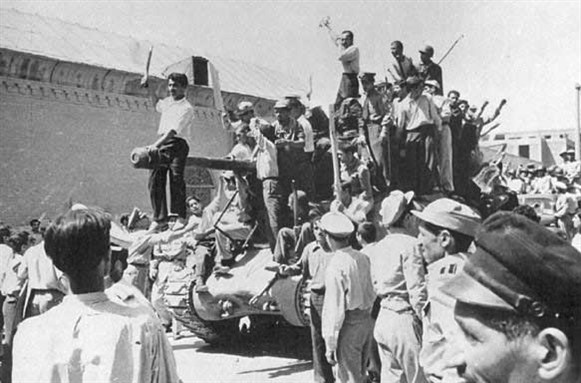 [Tanks in the streets of Tehran in 1953. Image via Wilipedia]