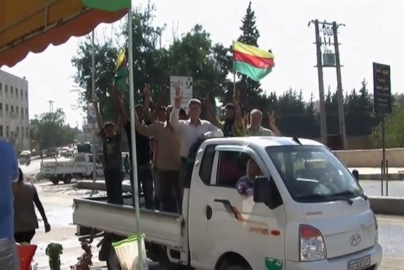 [PYD supporters in Afrin, August 2012. Image via Wikimedia Commons.] 