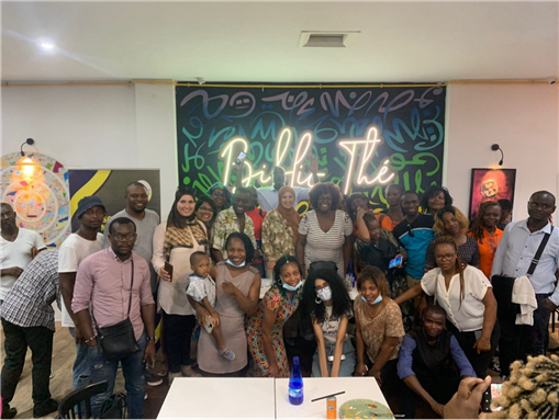Presentation of M’nemty’s professional training project. Photo taken in July 2022 in Tunis. Saadia Mosbah is standing in the first row, in the center (woman with black-and-white stripped dress and dark brown Afro). The author standing to the left of Mosbah (fifth person in the row to her left).