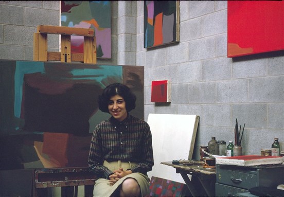 [Samia Halaby in her studio at Indiana University shortly before receiving an MFA in painting (1962). Image courtesy of the artist.]