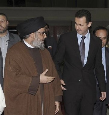 [Sayyid Hasan Nasrallah and President Bashar al-Asad. Image from unknown archive.]