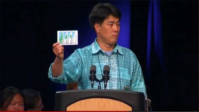 [A committee chairman speaks in favor of divestment. Image from video below.]