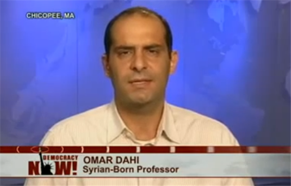 [Freezeframe from Democracy Now! interview with Omar Dahi.]