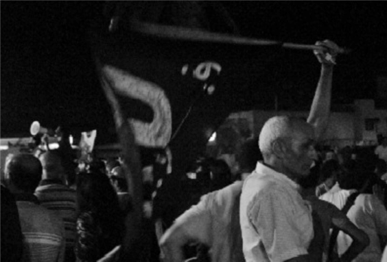 [An image taken at a February 20th Movement protest in Bab El Had, Rabat on 22 July 2012. Image by author.]