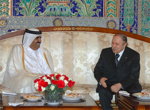 [Algerian President Abdelaziz Bouteflika, right, speaks with Qatar Emir Hamad Bin Khalifa Al Thani at his arrival at Algiers airport Wednesday, 18 May 2011. Image by AP Photo/Sidali Djarboub.]