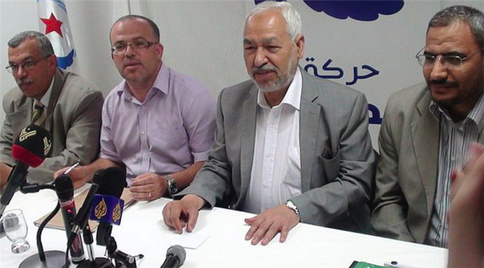 [Members of Ennahda hold a press conference in Tunisia, with their leader, Rachid Ghannouchi, in the center. Image by Monia Ghanmi/Magharebia.]