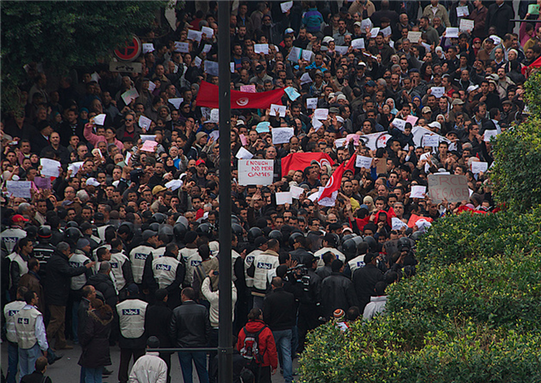 [Protesters march during a demonstration in Tunisia on 20 January 2011. Image by cjb22/Flickr.]