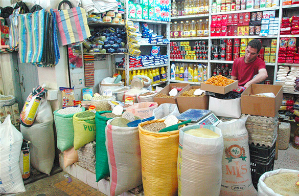 [Image of a shopkeeper in Algeria. Image by Ademe Amine/Magharebia.]