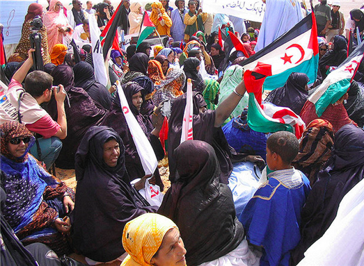 [Image of Sahrawi women protesting against Moroccan policies in the Western Sahara. Image from Saharauiak/Flickr.]