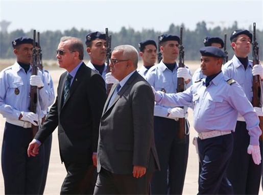 [Morocco`s Prime Minister Abdelilah Benkirane, right, and his Turkish counterpart Recep Tayyip Erdogan review the honor guard during a welcome ceremony at Rabat airport, Morocco, Monday, 3 June 2013. Erdogan was in Morocco for a two-day visit. As riot police used tear gas against protesters for a fourth straight day in Istanbul, Turkey`s president and prime minister displayed wide differences Monday in their responses to those taking to the streets. One death was reported. Image from Abdeljalil Bounhar/AP Photo.]